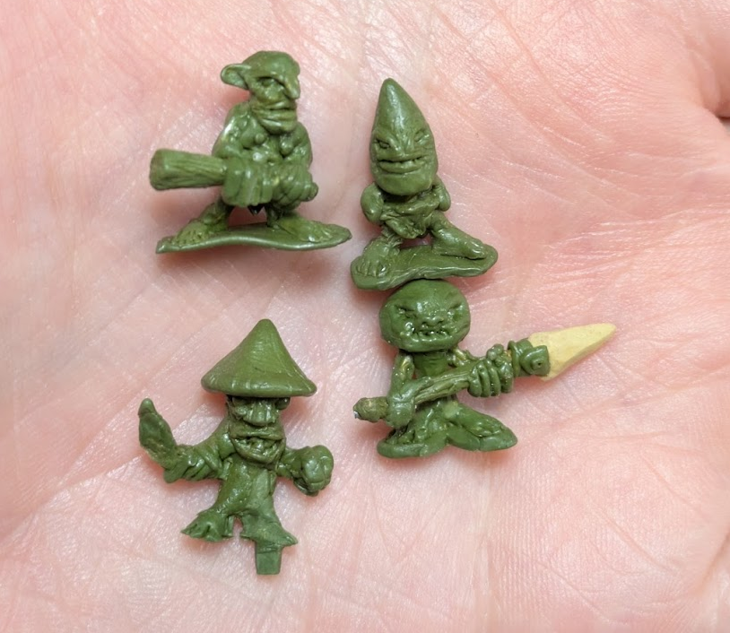 four little goblins. 3 of them are mushroom shaped